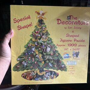 SunsOut "The Decorators" shaped jigsaw puzzle featuring art by Lori Schory